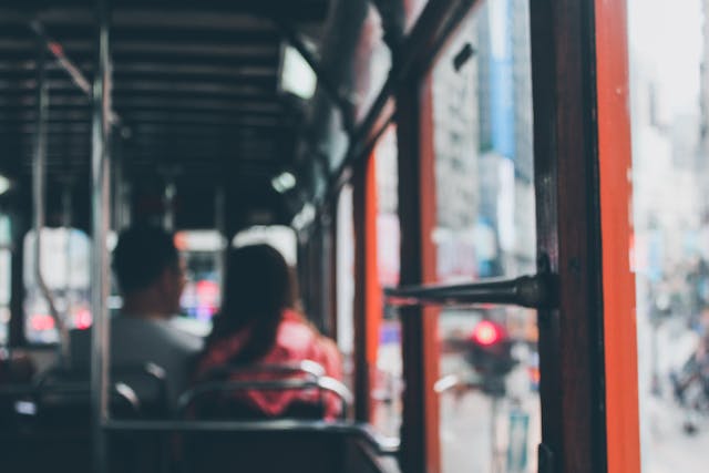 two%20people%20sitting%20inside%20a%20city%20bus two%20people%20sitting%20inside%20a%20city%20bus